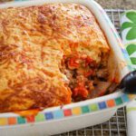 A baked tamale pie with cornmeal topping