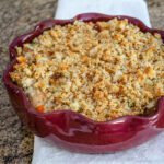 a baking dish with turkey and rice casserole